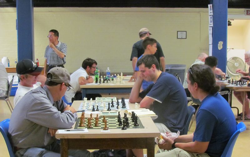 Players using chess clocks during a game