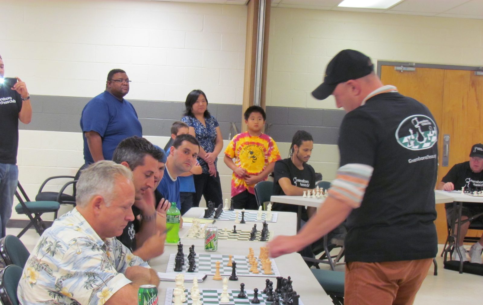 Grandmaster Alexander Shabalov playing a simultaneous exhibition against club members